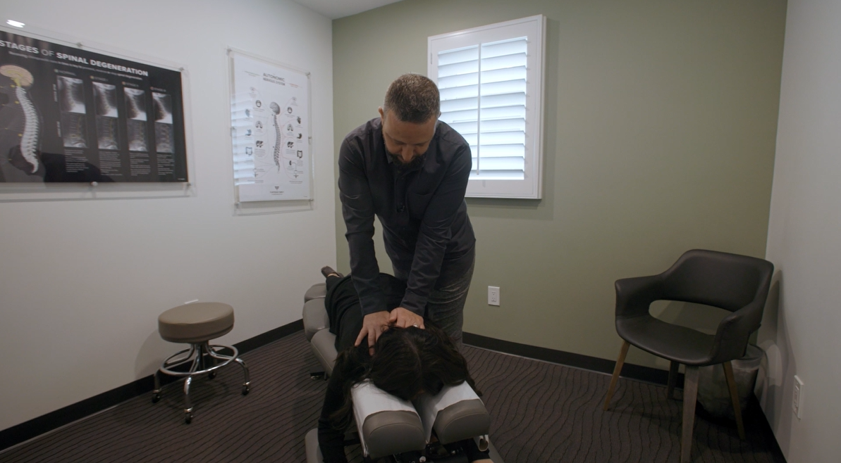 Dr. Shahbazian performing a cervical adjustment on a La Cañada patient